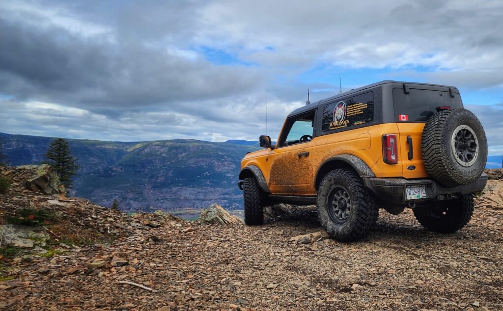 Orange testing vehicle in the mountains